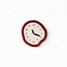 Ondara drip wall clock in red on a white background