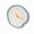 Ondara drip wall clock in baby blue on a white background