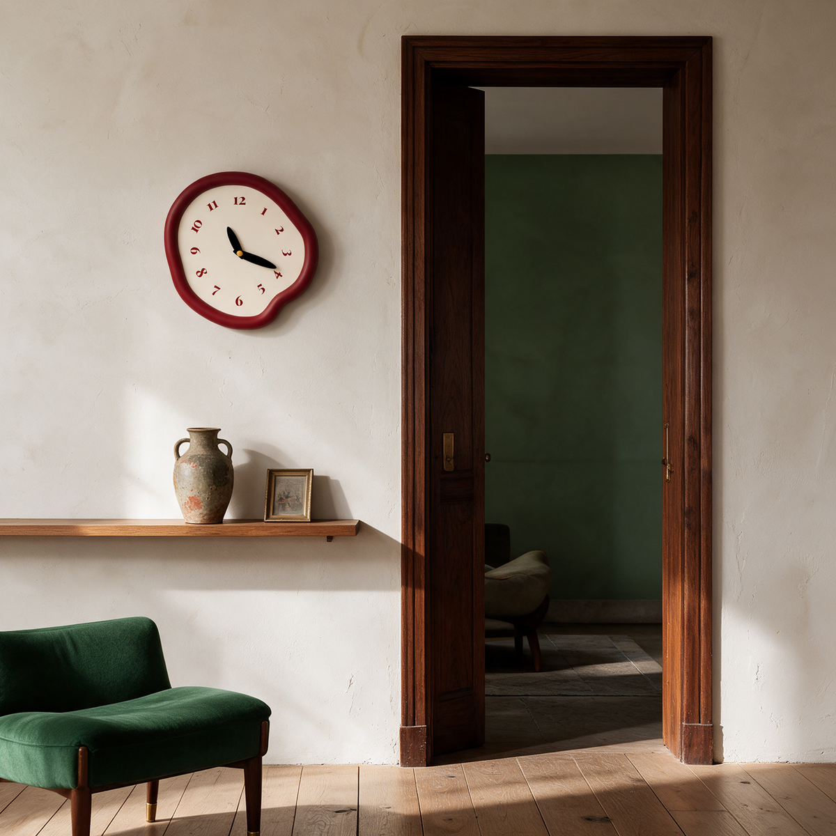Ondara clock in red beside a doorway shelf