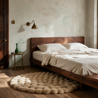 Nerja rug in khaki beside a bed