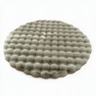 Nerja round bubble rug in green on a white background
