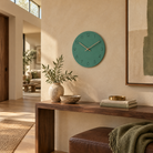 Caravaca Matte Round Silent Wall Clock with Wood Hands for Living Rooms, Sea Green, in the room